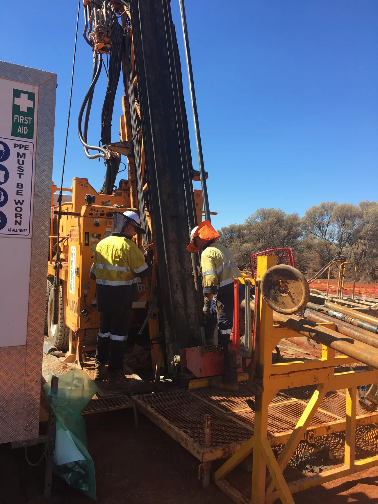 Drilling crew working at a field drill rig